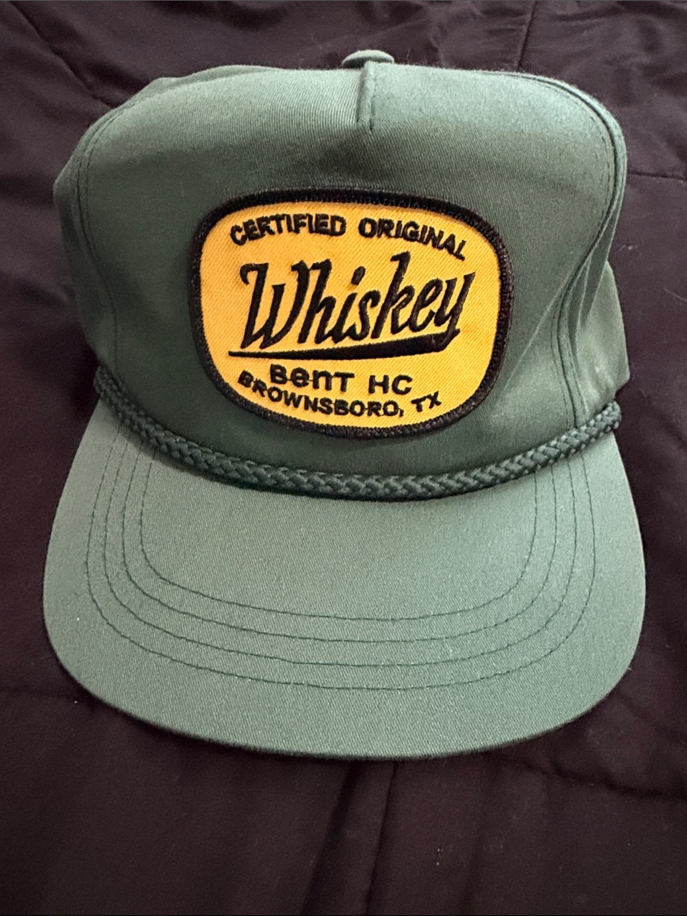 The Classic Green Trucker Hat with Yellow Whiskey Patch